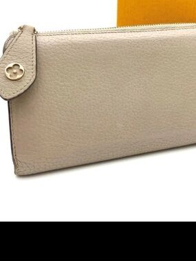 Louis Vuitton Taurillon Leather Zip Wallet in Beige color
